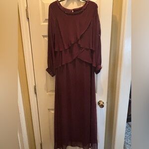 Burgundy full length elegant dress w/elegant beading on neckline and wrist cuff.